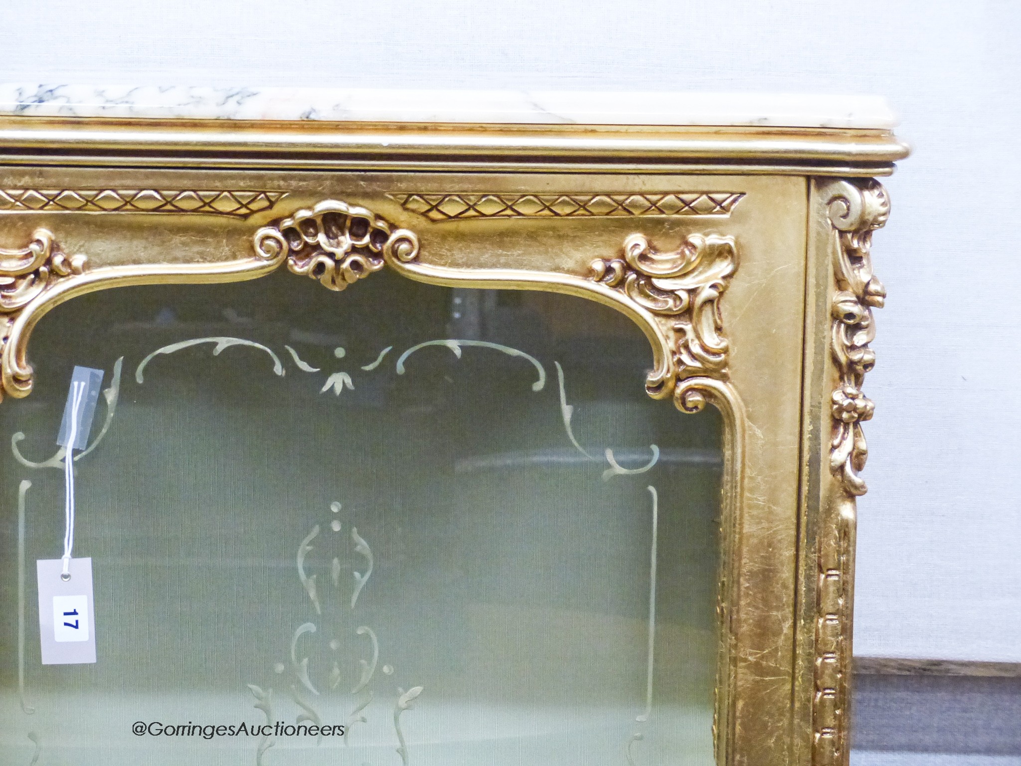 A marble topped gilt vitrine, width 73cm, depth 41cm, height 137cm